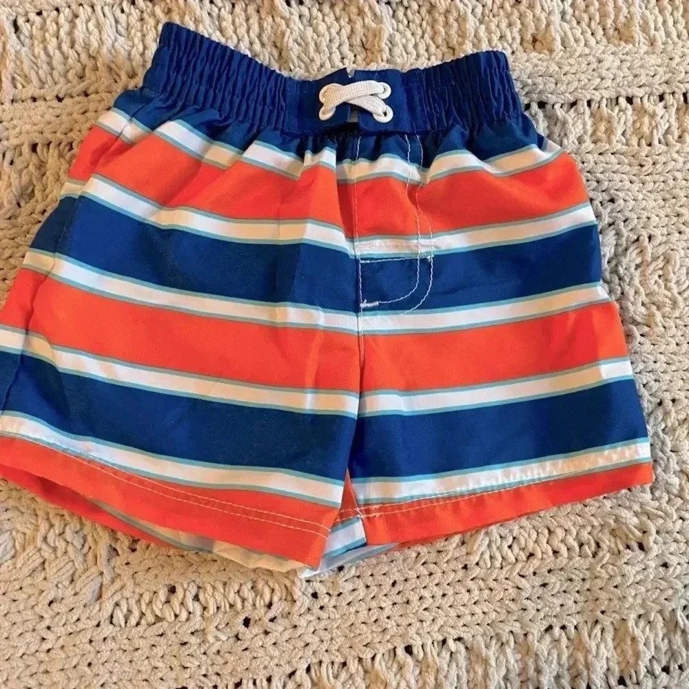 OP 0-3 months blue and orange striped swim trunks